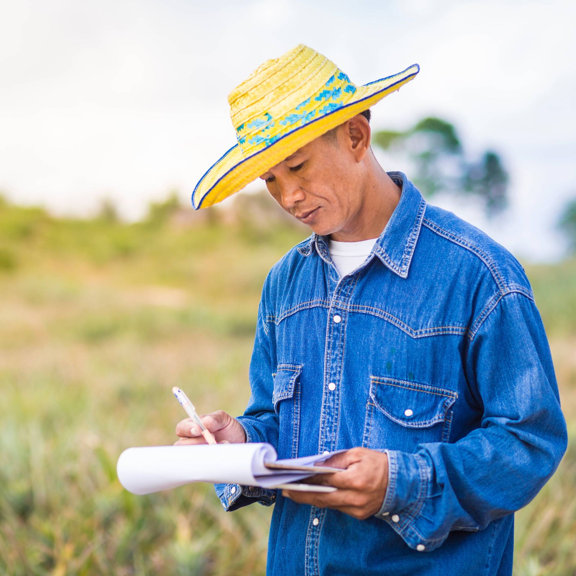 Image of a certification body auditor completing a checklist during a farm visit