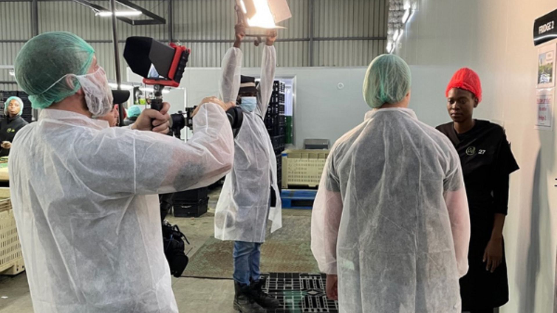 Image of team members filming the virtual farm visit in South Africa