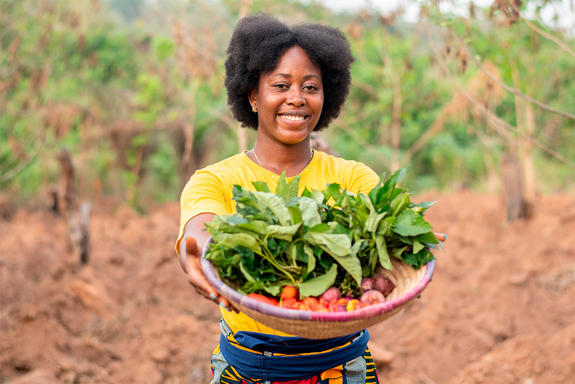 Image of a fruit and vegetable producer displaying produce from the farm