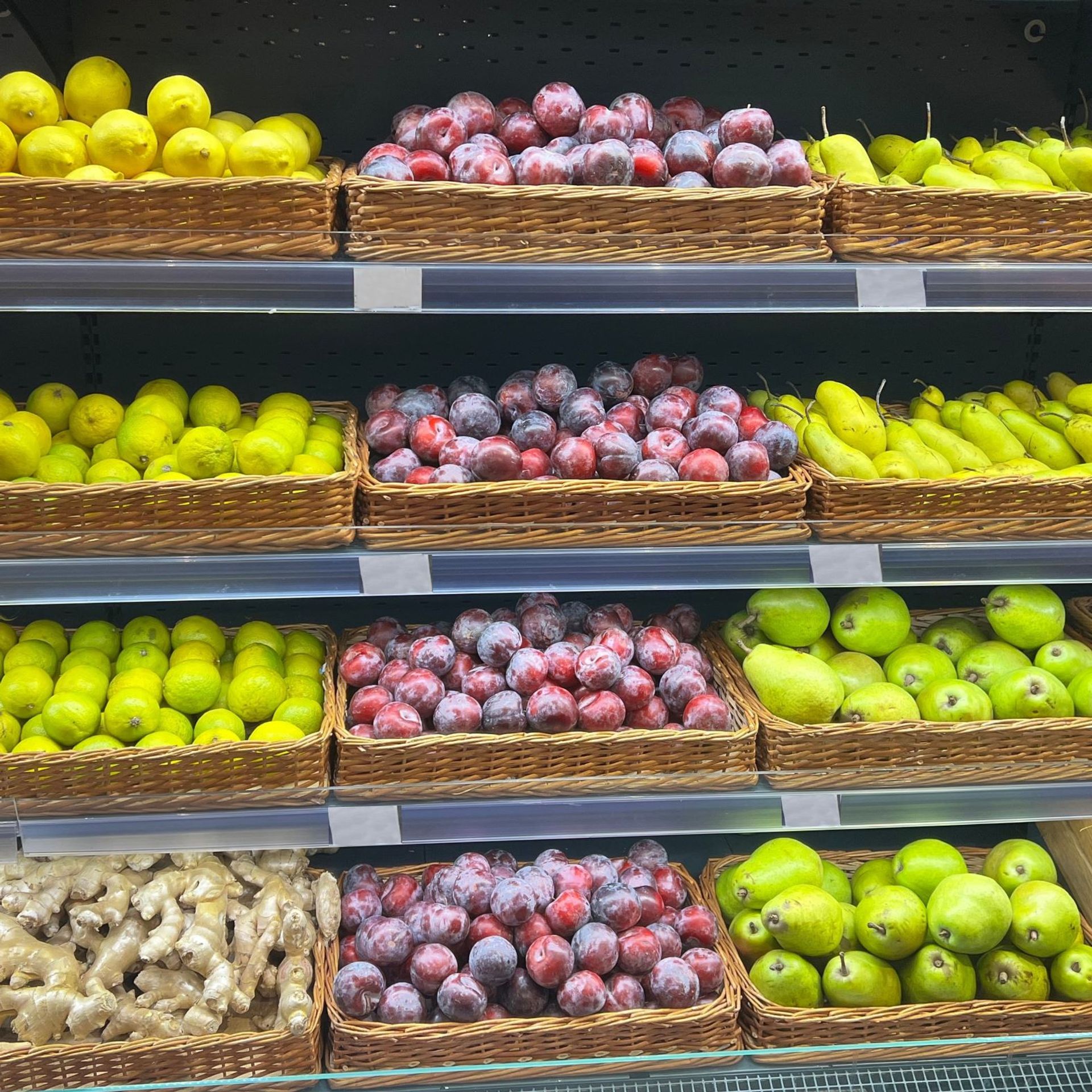 Assorted fruits and vegetables in baskets for sale